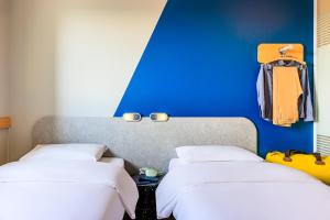 Postel nebo postele na pokoji v ubytování Ibis budget Lausanne-Bussigny + 31 fotografií