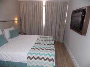 Кровать или кровати в номере Mirador Rio Copacabana Hotel