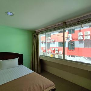 Postel nebo postele na pokoji v ubytování Best One Hotel
