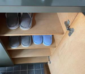 a pair of shoes in a cabinet drawer at アルピエb202号室 目の前に無料駐車場Wi-Fiあります in Kumamoto