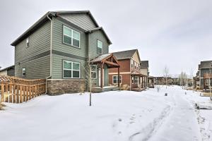 a house in the snow in a residential neighborhood at Gypsum Home with Patio Between Glenwood and Vail in Eagle