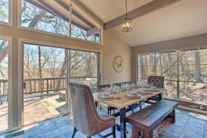 a dining room with a table and chairs and windows at Pottsboro Home Less Than Half-Mi to Lake Texoma! in Pottsboro