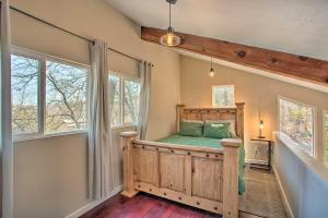 a bedroom with a bed in a room with windows at Pottsboro Home Less Than Half-Mi to Lake Texoma! in Pottsboro