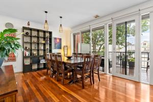 a dining room with a table and chairs at Kensington Escape - Balcony, BBQ and Parking in Melbourne