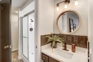 a bathroom with a sink and a mirror at Lake Hudson Home with Patio in Locust Grove in Locust Grove +19 photos