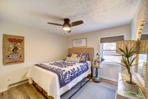a bedroom with a bed and a ceiling fan at Lake Hudson Home with Patio in Locust Grove in Locust Grove