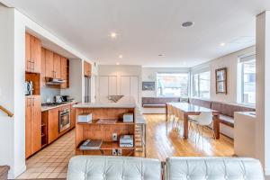 a kitchen and living room with a table and chairs at Wajima Niseko in Niseko