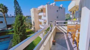 a balcony with a view of a building at STAY Vivid City Apartment in Limassol