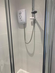 a shower in a bathroom with a glass shower stall at An Entire Fabulous Holiday Home - It’s All Yours! in Saint Columb Major