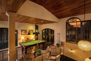 an indoor billiard room with a pool table at Clove Villa in Kandy