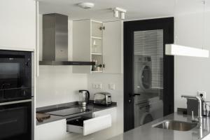 Kuchyňa alebo kuchynka v ubytovaní Prime Spanish Holidays - Marina Bay Apartment