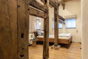 a bedroom with two bunk beds in a room at Biohotel WildLand Natural Resort in Hornbostel