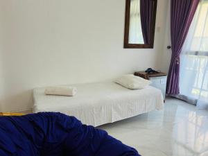 Letto o letti in una camera di Heaven Breeze