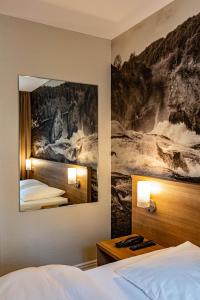 Voodi või voodid majutusasutuse Hotel Kronenhof toas