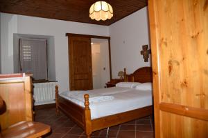 a small bedroom with a bed and a window at via SOIA 1 in Canale dʼAgordo