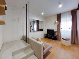 Televízia a/alebo spoločenská miestnosť v ubytovaní Piazza di Spagna - Suite Donata, strollingrome