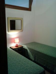 Postel nebo postele na pokoji v ubytování Appartamenti Le Fontanelle