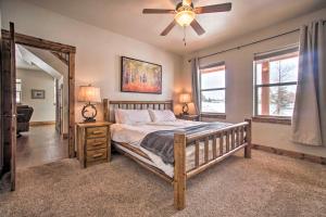 Un dormitorio con una cama y un ventilador de techo. en McCall Home and Hot Tub about 2 Mi to Payette Lake, en McCall