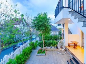 a balcony of a house with a swimming pool at Lavini House in Da Lat