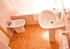 a bathroom with a sink and a toilet at Insotel Club Maryland in Playa Migjorn +18 photos
