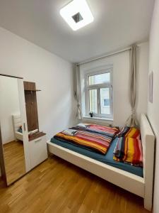 a bedroom with a large bed with a window at Deluxe Studio 3P TH in Vienna