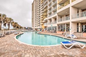 a swimming pool in front of a building at Oceanfront Resort Condo in North Myrtle Beach in Myrtle Beach