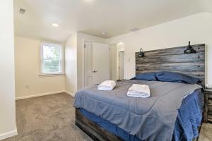 a bedroom with a large bed with two towels on it at Pennsylvania Vacation Rental Close to Hiking in York