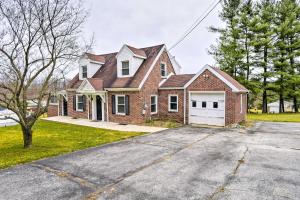 a large brick house with a white garage at Pennsylvania Vacation Rental Close to Hiking in York