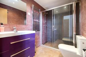 a bathroom with a purple sink and a shower at Holiday home Splendid Park Güell in Barcelona +72 photos