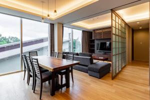 a dining room and living room with a table and chairs at 水晶- Suishou in Niseko