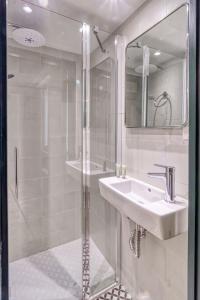 a bathroom with a shower and a sink and a mirror at ZUBIETA by SWEET HOME SAN SEBASTIAN in San Sebastián +17 photos