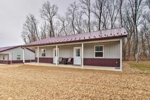 een klein wit huis met een rood dak bij Peaceful Missouri Cabin Rental on 55 Acres! in Canton