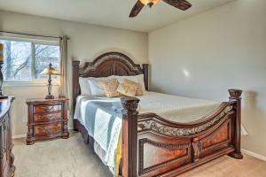 a bedroom with a large bed and a window at Colorado Springs House 5 Mi to Downtown in Colorado Springs