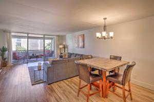 a living room with a table and a couch at Scottsdale Resort Condo Near Old Town! in Scottsdale
