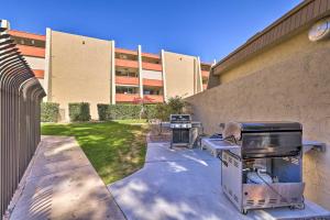 a grill sitting outside of a building next to a building at Scottsdale Resort Condo Near Old Town! in Scottsdale