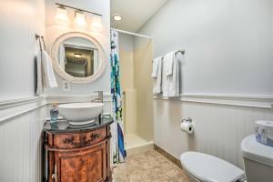 a bathroom with a sink and a mirror and a toilet at St Augustine Island Home with Patio, Walk to Beach! in Saint Augustine +20 photos