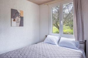 Postel nebo postele na pokoji v ubytování Salty Pebble House