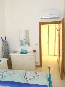Cama ou camas em um quarto em Residence Porto Coda Cavallo