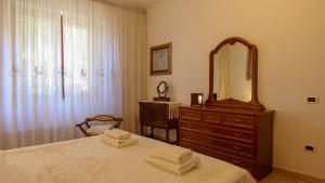Letto o letti in una camera di Casa Pia