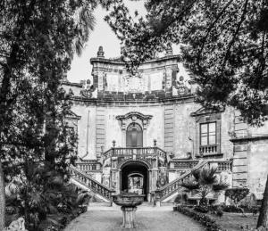 a black and white photo of a building with a staircase at Holiday Sicily “S&M” in Ficarazzi