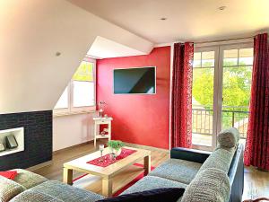 Μια τηλεόραση ή/και κέντρο ψυχαγωγίας στο Ferienwohnungen Haus Sommerlust