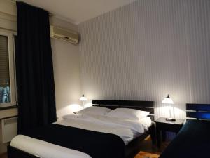 Letto o letti in una camera di Selection Rooms