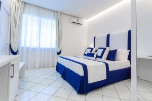 Postel nebo postele na pokoji v ubytování Hotel Bristol