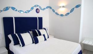 Postel nebo postele na pokoji v ubytování Hotel Bristol