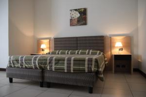 Ένα ή περισσότερα κρεβάτια σε δωμάτιο στο Hotel Santo Stefano