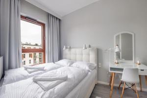Posteľ alebo postele v izbe v ubytovaní Nowa Motława, Sun & Snow