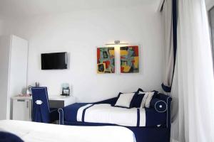 Postel nebo postele na pokoji v ubytování Hotel Bristol