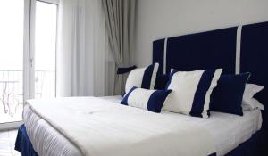 Postel nebo postele na pokoji v ubytování Hotel Bristol