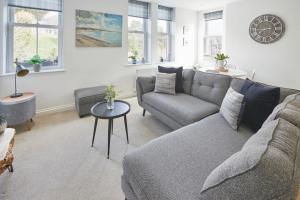 a living room with a couch and a table at Host & Stay - Number 2 at Pannett Apartments in Whitby