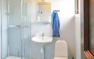 a bathroom with a sink and a shower at Holiday Home Lertagsvägen Mörbylånga in Mörbylånga